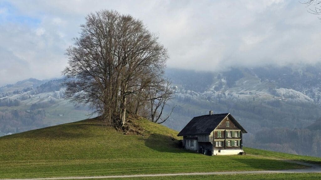 Charming alpine cottage in Switzerland's Winter scape.