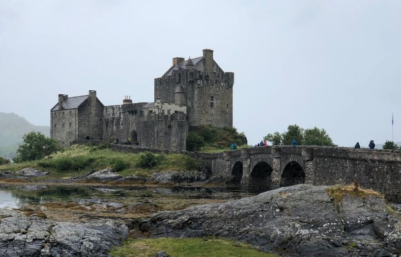 Eilean Donan Castle in Scotland on overcast day.